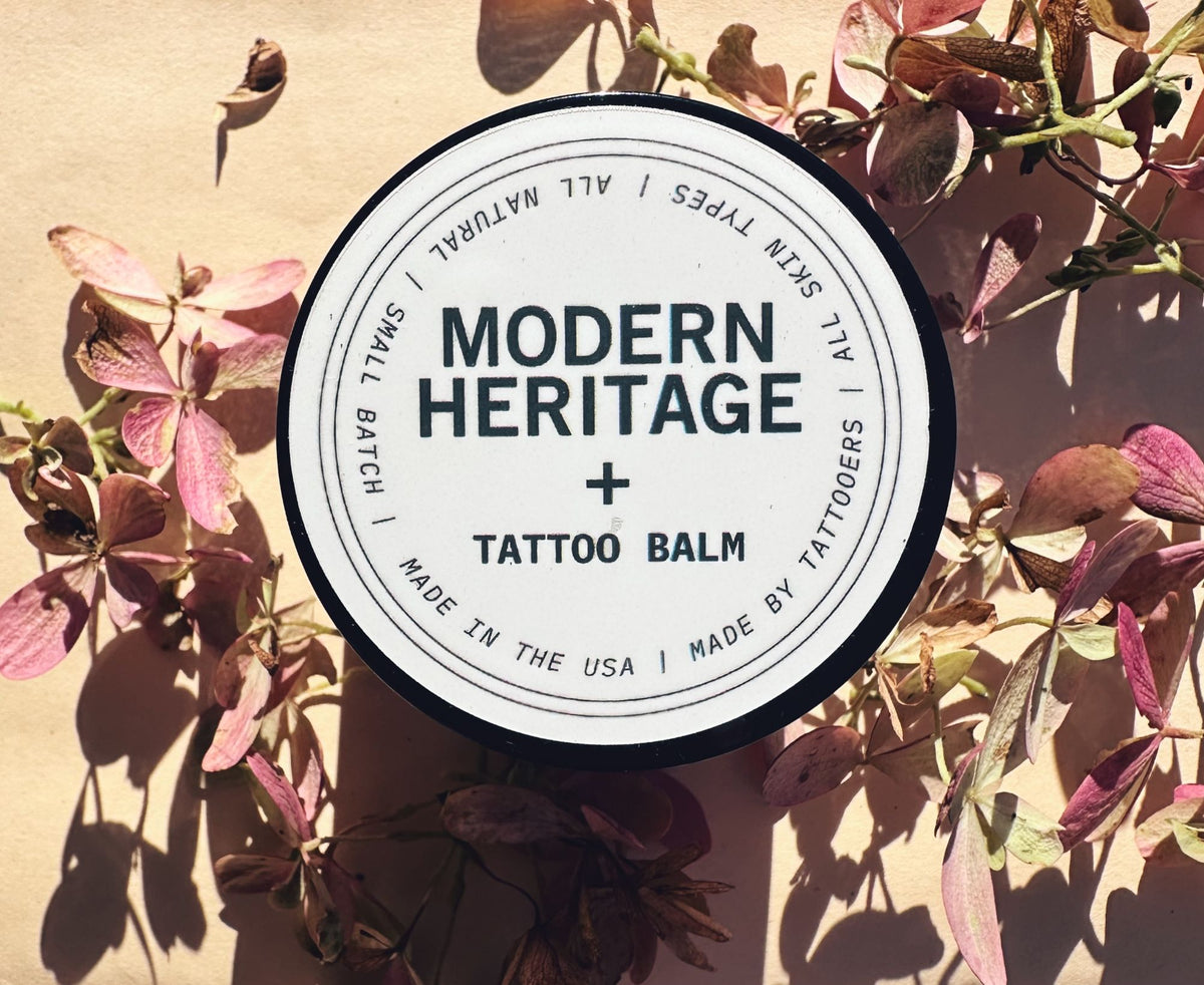 Modern Heritage tattoo balm lid on dried flowers