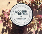 Modern Heritage tattoo balm lid on dried flowers